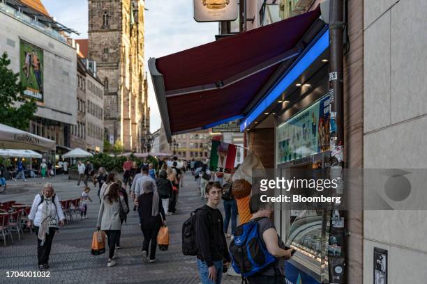 Customer at an ice cream vendor in Nuremberg, Germany, on Monday, Oct. 2, 2023. German inflation plunged to its lowest level in two years after the...