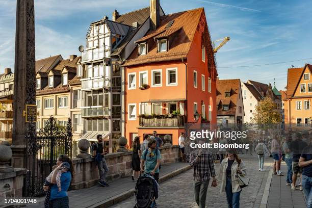 Shoppers and tourists on the Karlsbrucke bridge in Nuremberg, Germany, on Monday, Oct. 2, 2023. German inflation plunged to its lowest level in two...