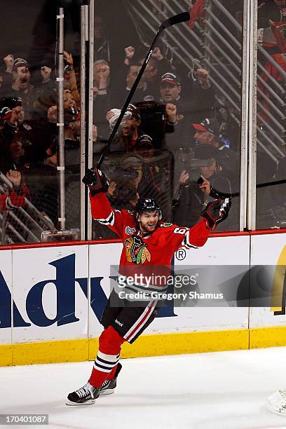Michael Frolik of the Chicago Blackhawks celebrates in the third period after Johnny Oduya of the Chicago Blackhawks scored a goal against the Boston...