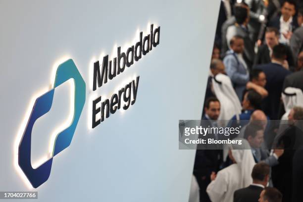 Signage for Mubadala Energy above the company's booth on day two of the Abu Dhabi International Petroleum Exhibition and Conference in Abu Dhabi,...