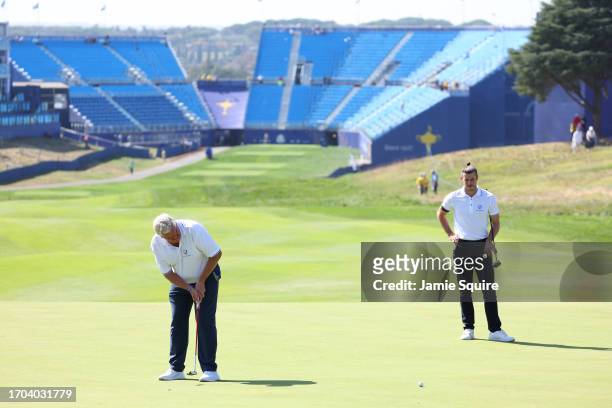 Former footballer, Gareth Bale and Colin Montgomerie of Scotland on the first green during the All-Star Match at the 2023 Ryder Cup at Marco Simone...