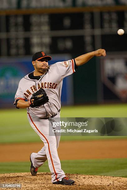 Jose Mijares of the San Francisco Giants pitches during the game against the Oakland Athletics at O.co Coliseum on May 28, 2013 in Oakland,...