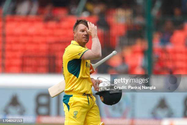 David Warner of Australia makes their way off after being dismissed during the ICC Men's Cricket World Cup India 2023 warm up match between Pakistan...