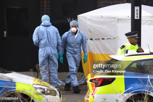 Police work at the scene of a fatal stabbing of a fifteen year old girl, behind the Whitgift Shopping Centre on September 27, 2023 in Croydon,...
