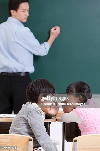 Schoolchildren And Teacher In Class, Foto de stock