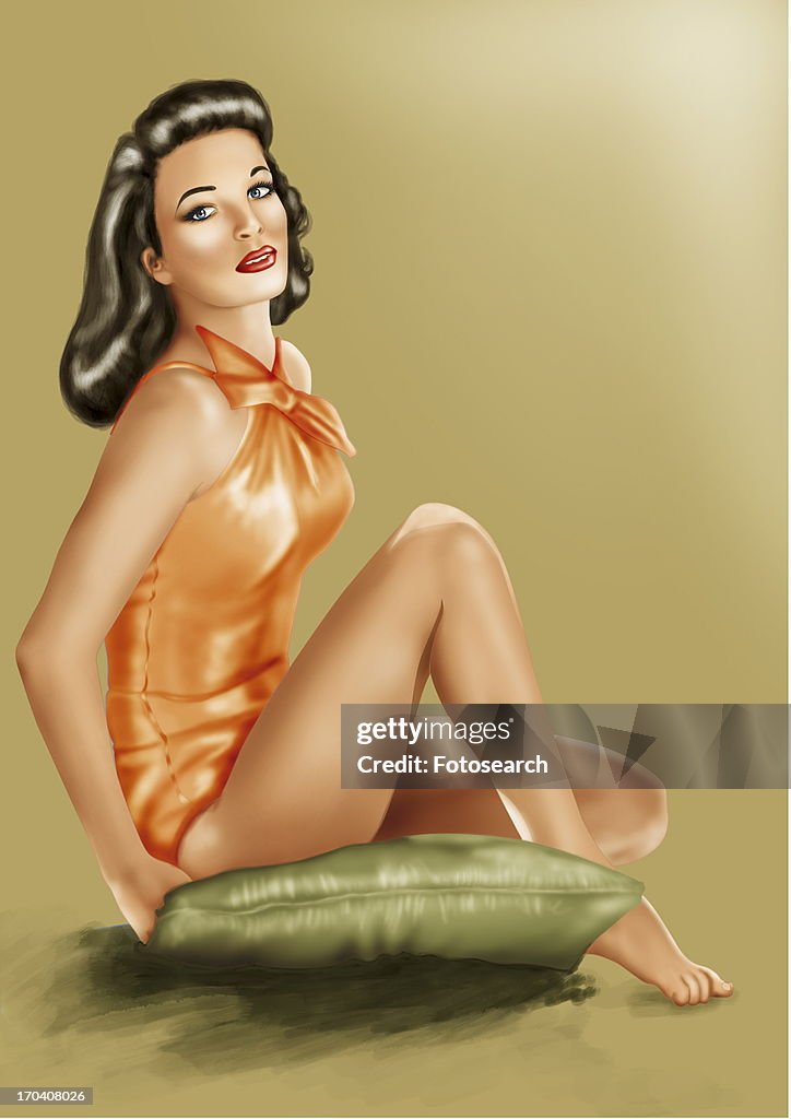 Pinup girl sitting on green cushion