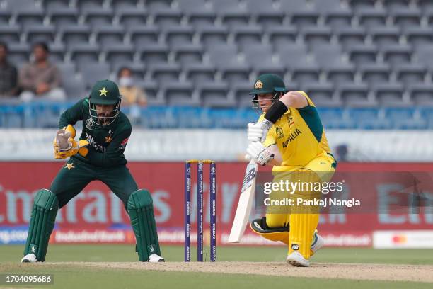Steven Smith of Australia plays a shot during the ICC Men's Cricket World Cup India 2023 warm up match between Pakistan and Australia at Rajiv Gandhi...