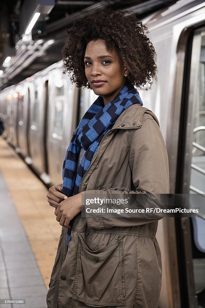 Woman walking on subway platform