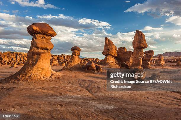 rock formations in dry landscape - goblin valley state park stock pictures, royalty-free photos & images