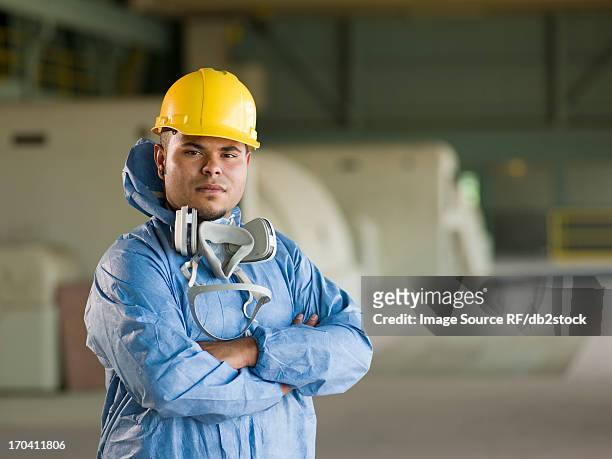 engineer wearing protective suit on site - clean suit fotografías e imágenes de stock