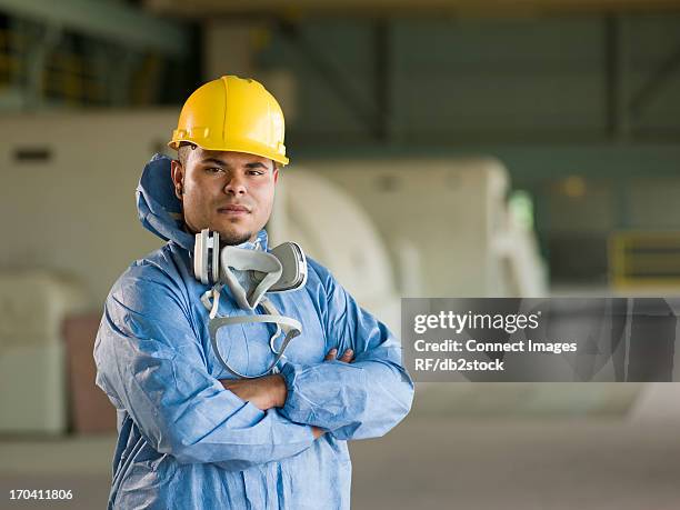 engineer wearing protective suit on site - confident young man at work stock pictures, royalty-free photos & images