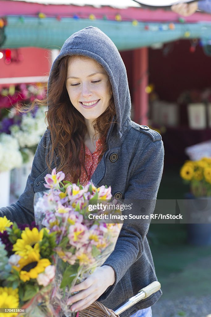 Woman buying flowers at florist