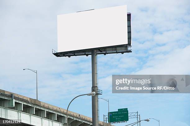 blank billboard over freeway - highway billboard stock pictures, royalty-free photos & images