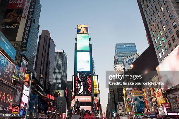 illuminated billboards in times square - times square stock pictures, royalty-free photos & images