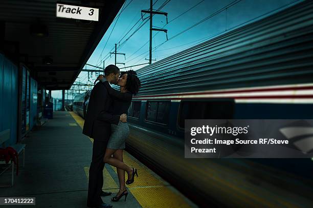 couple kissing at train station - bridgeport connecticut fotografías e imágenes de stock