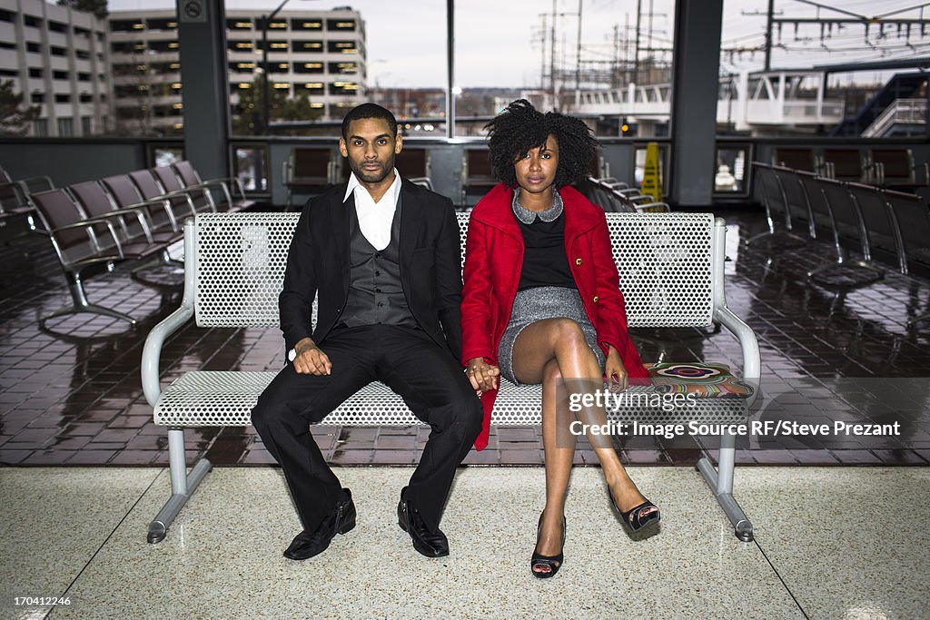 Couple on bench at train station