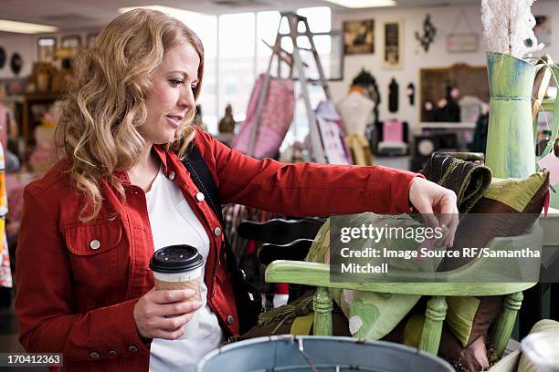 woman shopping in thrift store - price utah bildbanksfoton och bilder