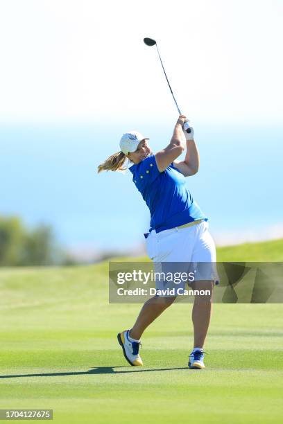 Caroline Hedwall of The European Team plays her second shot on the 18th hole in her match against Ally Ewing during the final day singles matches on...