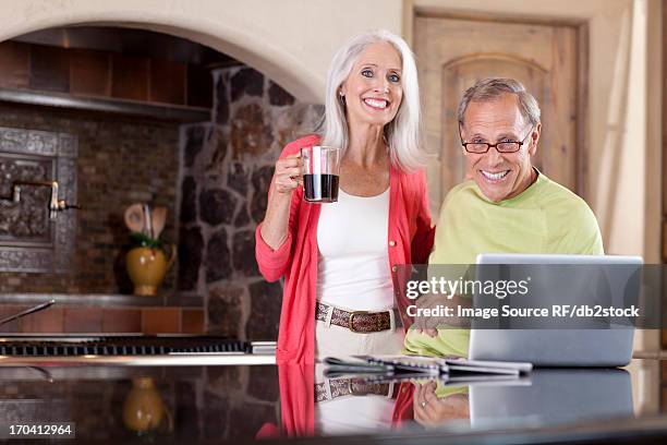 older couple using laptop at breakfast - scottsdale arizona house stock pictures, royalty-free photos & images