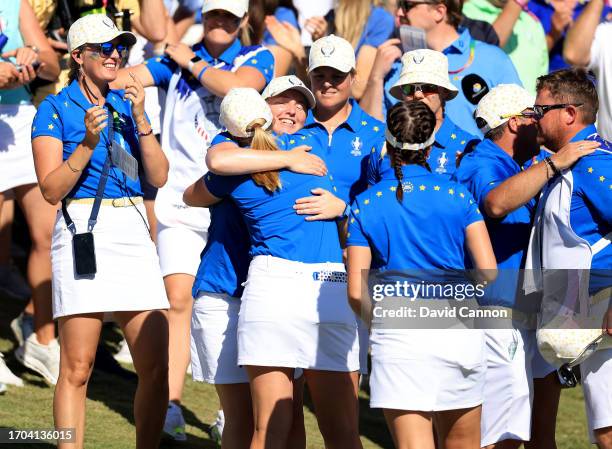 Maja Stark of The European Team is congratulated by Gemma Dryburgh and other European team members after wining her match against Allisen Corpuz...