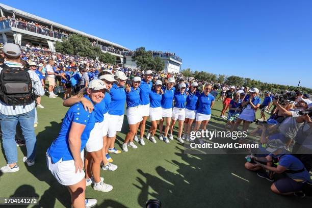 Gemma Dryburgh celebrates with fellow European Team members after retaining The Solheim Cup during the final day singles matches on Day Three of the...