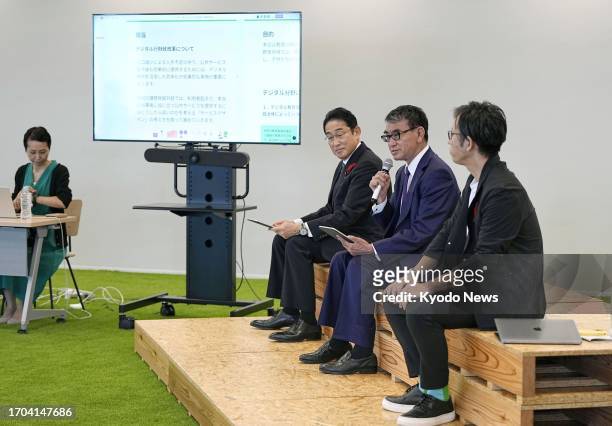 Japanese Prime Minister Fumio Kishida and Digital Minister Taro Kono attend a meeting with experts to discuss measures to implement administrative...