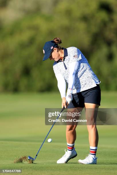 Ally Ewing of The United States team plays her second shot on the 15th hole in her match with Nelly Korda against Charley Hull and Leona Maguire...