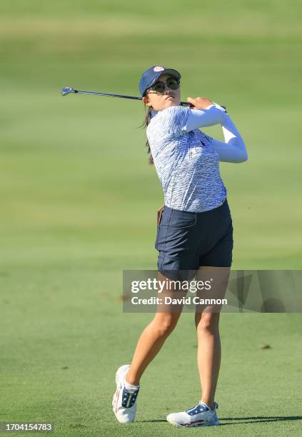Rose Zhang of The United States team plays her second shot on the ninth hole in her match with Andrea Lee against Madelene Sagstrom and Emily...