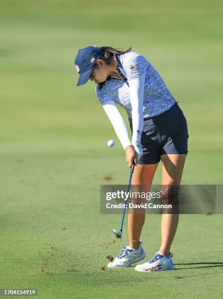 Rose Zhang of The United States team plays her second shot on the ninth hole in her match with Andrea Lee against Madelene Sagstrom and Emily...