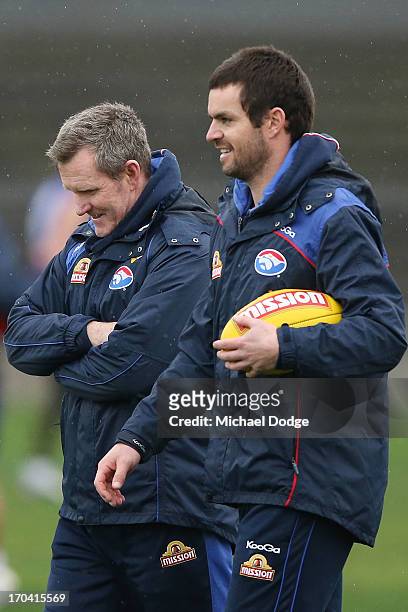 Coach Brendan McCartney walks with assistant coach Matthew Scarlett during a Western Bulldogs AFL training session at Whitten Oval on June 13, 2013...