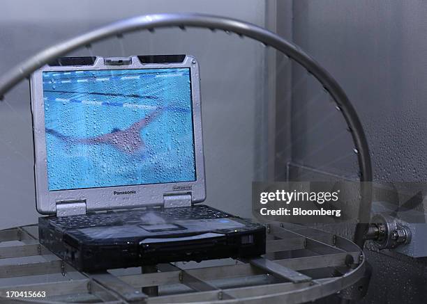 Panasonic Corp.'s Toughbook laptop computer undergoes a water resistance test at the company's plant in Kobe City, Hyogo Prefecture, Japan, on...