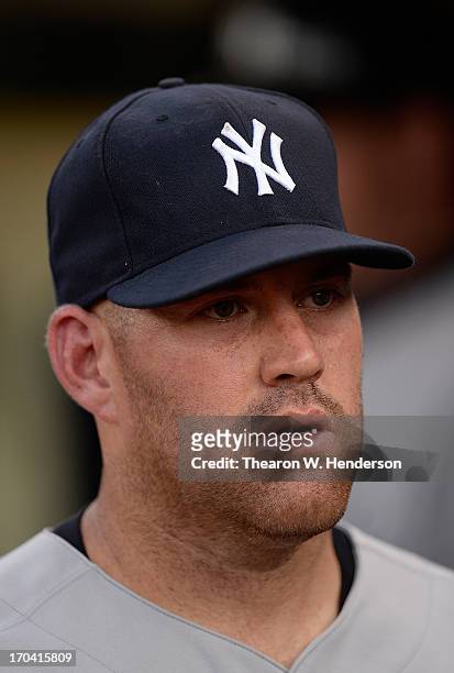 Kevin Youklis of the New York Yankees looks on from the dugout against the Oakland Athletics at O.co Coliseum on June 11, 2013 in Oakland, California.