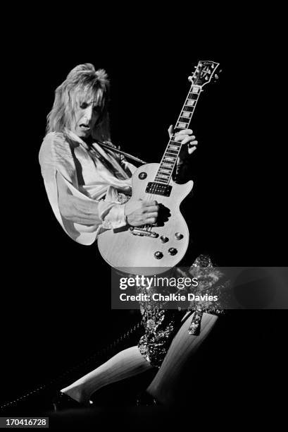 Mick Ronson performs on stage at Hammersmith Odeon on the last night of the Ziggy Stardust Tour, London, 3rd July 1973. At the end of the show David...