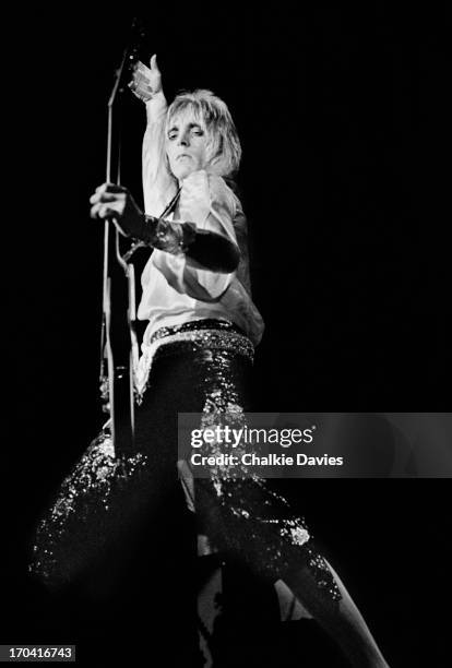 Mick Ronson performs on stage at Hammersmith Odeon on the last night of the Ziggy Stardust Tour, London, 3rd July 1973. At the end of the show David...