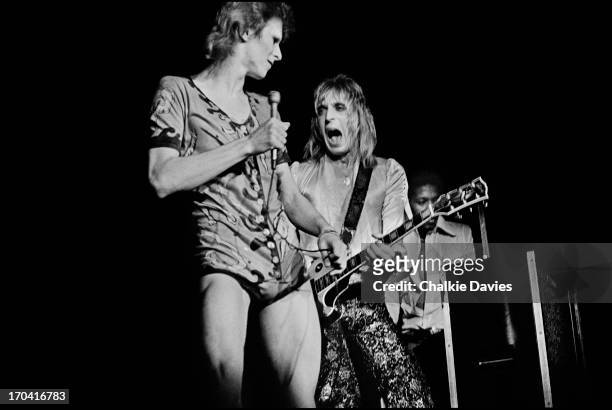 David Bowie and Mick Ronson perform on stage at Hammersmith Odeon on the last night of the Ziggy Stardust Tour, London, 3rd July 1973. At the end of...