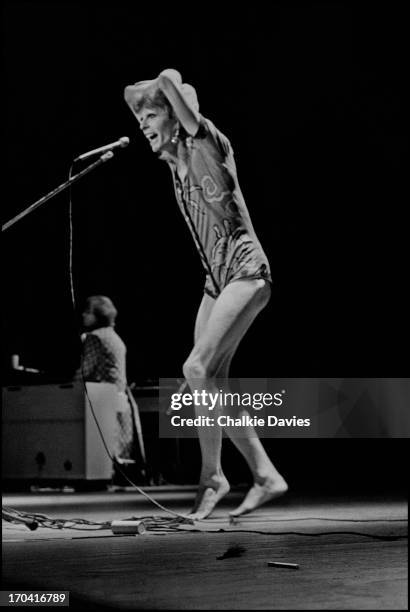 David Bowie performs on stage at Hammersmith Odeon on the last night of the Ziggy Stardust Tour, London, 3rd July 1973. At the end of the show David...