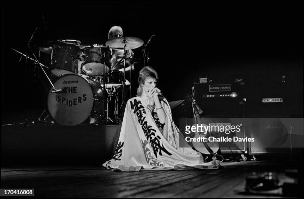 David Bowie performs on stage at Hammersmith Odeon on the last night of the Ziggy Stardust Tour, London, 3rd July 1973. At the end of the show David...