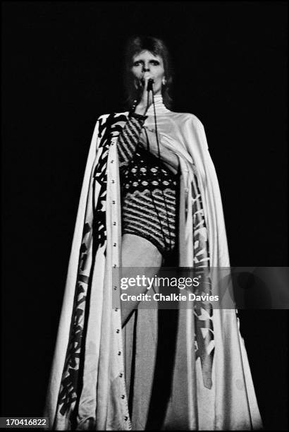 David Bowie performs on stage at Hammersmith Odeon on the last night of the Ziggy Stardust Tour, London, 3rd July 1973. At the end of the show David...