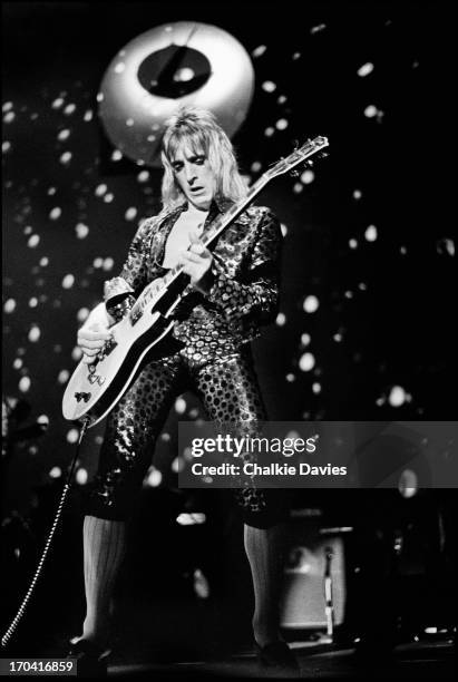 Mick Ronson performs on stage at Hammersmith Odeon on the last night of the Ziggy Stardust Tour, London, 3rd July 1973. At the end of the show David...