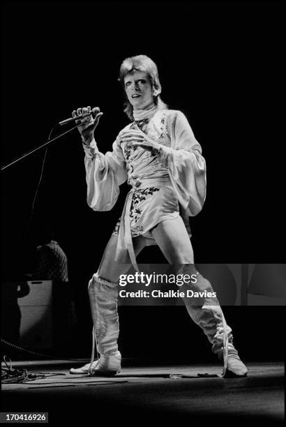 David Bowie performs on stage at Hammersmith Odeon on the last night of the Ziggy Stardust Tour, London, 3rd July 1973. At the end of the show David...