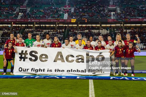 Spain and Switzerland squads poses with a banner #Se Acabo as protest prior the UEFA Women's Nations League Group D match between Spain and...