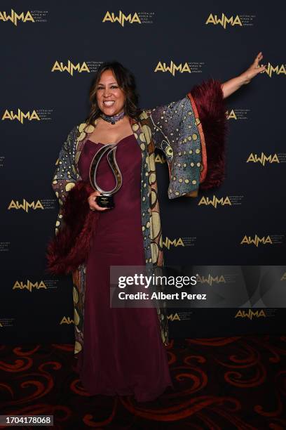 Kate Ceberano poses for photographs after receiving a Lifetime Achievement Award during the Australian Women in Music Awards at the Tivoli on...