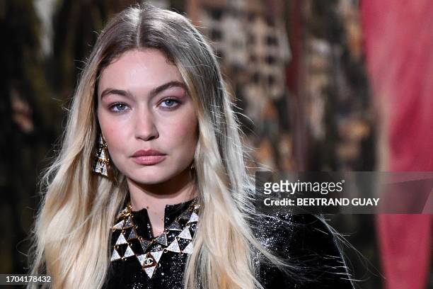 Model Gigi Hadid walks the runway to present a creation by Chanel during the Paris Fashion Week Womenswear Spring/Summer 2024 at the Grand Palais...
