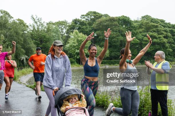 a jog in the rain - social following stock pictures, royalty-free photos & images