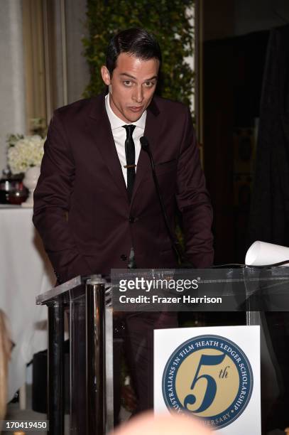 Actor James Mackay addresses the audience from the podium at the Australians In Film and Heath Ledger Scholarship Host 5th Anniversary Benefit Dinner...