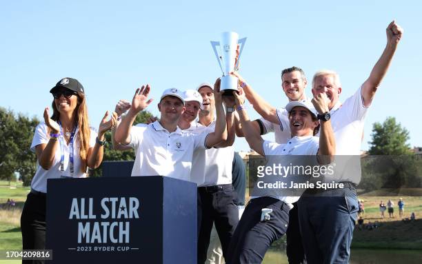 Kipp Poppert, Garrett Hilbert, Novak Djokovic, Gareth Bale, Leonardo Fioravanti, and Colin Montgomerie celebrate with the trophy following victory...