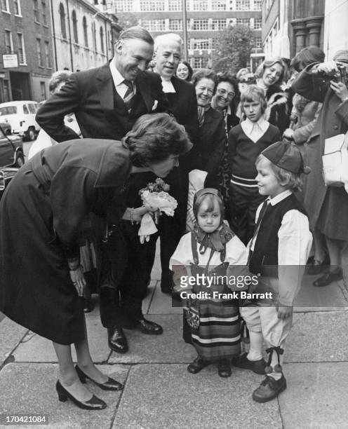 Crowd watches as Princess Margaretha of Sweden and husband John Ambler chat to six year old Mattias Revelios and three year old Sophie Persson at the...