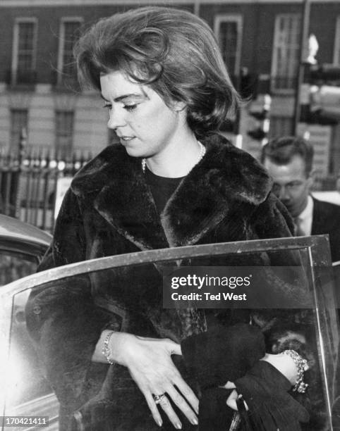 Princess Margaretha of Sweden outside the Swedish Embassy entering her fiance John Ambler's car to go on a shopping expedition in London, 9th March...
