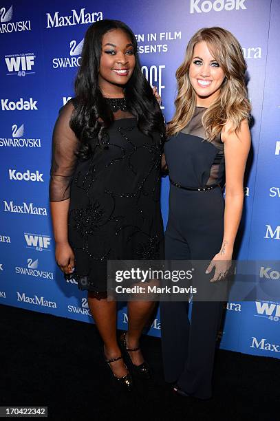 Singers Candice Glover and Angie Miller pose backstage at Women In Film's 2013 Crystal + Lucy Awards at The Beverly Hilton Hotel on June 12, 2013 in...