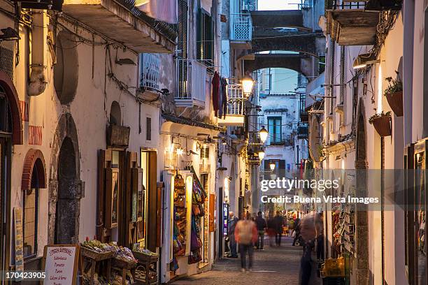 busy street in a mediterranean village - costiera amalfitana foto e immagini stock